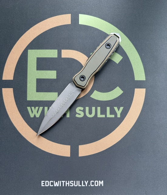 Folding knife resting on a dark background featuring the circular EDC with Sully logo and text 'EDC with Sully'.