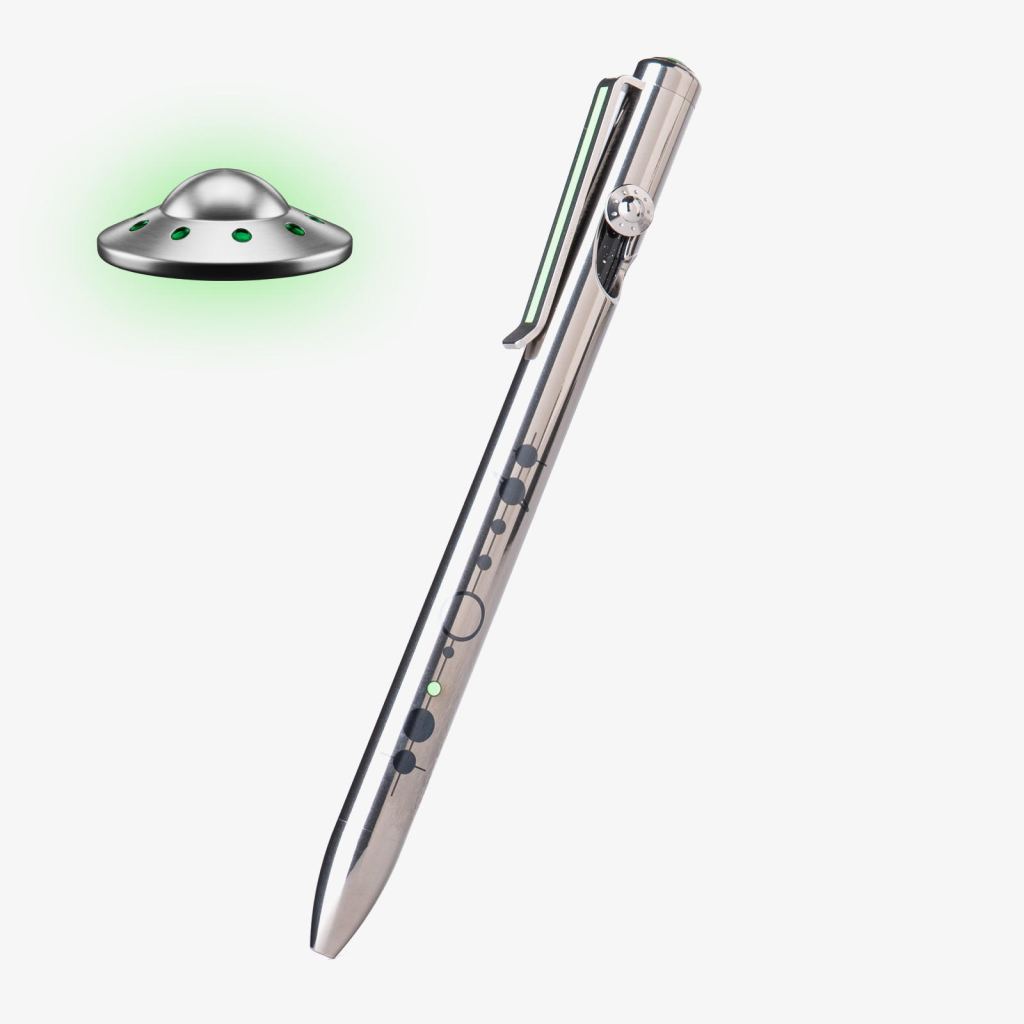 Metallic stylus pen tilted diagonally with a small chrome saucer UFO emitting a green glow nearby on a light background.